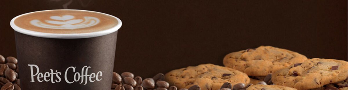 Peet's coffee surrounded by cookies and coffee beans