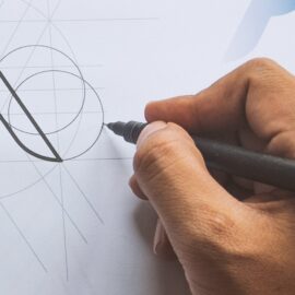 Graphic Designer sketching logo